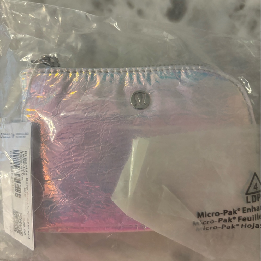 Lululemon Iridescent Coin Purse never used, still in packaging!